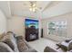 Cozy living room featuring a modern fireplace, neutral color scheme, and comfortable seating at 2050 28Th N Ave, St Petersburg, FL 33713