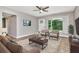 Bright living room with a large window, a ceiling fan, stylish furniture and contemporary decor at 2054 Deerwood Rd, Seffner, FL 33584