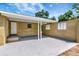 Covered patio area ideal for outdoor entertaining and relaxation at 2054 Deerwood Rd, Seffner, FL 33584