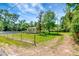 Spacious yard surrounding a charming home with mature trees, offering privacy and outdoor enjoyment at 2054 Deerwood Rd, Seffner, FL 33584
