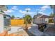 Cozy backyard featuring white rock landscaping, a wooden picnic table with umbrella and a new fence at 220 19Th S Ave, St Petersburg, FL 33705