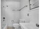 All-white bathroom featuring a shower-tub combo, toilet, and vanity with a sink at 220 19Th S Ave, St Petersburg, FL 33705