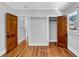 Empty room with hardwood floors, and two closets with wood doors at 220 19Th S Ave, St Petersburg, FL 33705