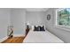 This bedroom features a window, gray walls, hardwood floors, and a full size bed at 220 19Th S Ave, St Petersburg, FL 33705