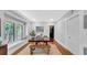 Bright dining room with window seating, hardwood floors, and access to the kitchen at 220 19Th S Ave, St Petersburg, FL 33705