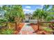 Charming bungalow-style home with mature landscaping and brick pathway to the front door at 220 19Th S Ave, St Petersburg, FL 33705