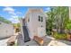 Rear exterior view of home with stairs to a second-floor entrance and a garage at 220 19Th S Ave, St Petersburg, FL 33705