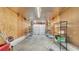 Spacious garage with a roll-up door, shelving for storage, and ample space for vehicles at 220 19Th S Ave, St Petersburg, FL 33705