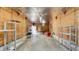 Spacious garage interior with plywood walls, shelving units, and a concrete floor at 220 19Th S Ave, St Petersburg, FL 33705