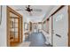 Inviting hallway with windows, detailed trim, and a classic ceiling fan at 220 19Th S Ave, St Petersburg, FL 33705