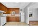 Kitchen with vintage cabinets, appliances, and patterned flooring at 220 19Th S Ave, St Petersburg, FL 33705