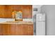 Traditional kitchen featuring wood cabinets, a double basin sink, and a white refrigerator at 220 19Th S Ave, St Petersburg, FL 33705