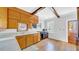 Functional kitchen with wooden cabinets, hardwood floors, and a view of the backyard at 220 19Th S Ave, St Petersburg, FL 33705