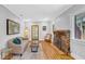 Inviting living room with hardwood floors, brick fireplace, and stylish furnishings at 220 19Th S Ave, St Petersburg, FL 33705