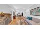 Open-concept living space with exposed brick fireplace and hardwood floors at 220 19Th S Ave, St Petersburg, FL 33705
