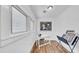 Bright office space with hardwood floors, natural light, and an accent painting creating a comfortable work area at 220 19Th S Ave, St Petersburg, FL 33705