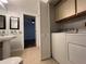 Bathroom with in-unit washer and dryer at 2333 Feather Sound Dr # B104, Clearwater, FL 33762