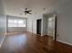 Spacious bedroom boasts wood floors, a ceiling fan, recessed lighting, and large windows with blinds at 2333 Feather Sound Dr # B104, Clearwater, FL 33762