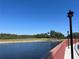 Scenic view of the golf course near the water, complemented by elegant walkway lighting and lush greenery at 2333 Feather Sound Dr # B104, Clearwater, FL 33762