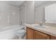 Bright bathroom with a tub-shower combination and a single sink vanity at 246 Castlekeeper Pl, Valrico, FL 33594