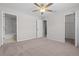 Spacious bedroom with ceiling fan, carpet, and closet at 246 Castlekeeper Pl, Valrico, FL 33594