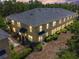 Stunning two-story townhome with manicured landscaping and ample windows at 246 Castlekeeper Pl, Valrico, FL 33594