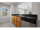 View of kitchen with stainless steel appliances and breakfast bar at 246 Castlekeeper Pl, Valrico, FL 33594