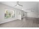 Spacious living area with contemporary flooring, large windows, and ample natural light at 246 Castlekeeper Pl, Valrico, FL 33594