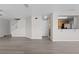 Spacious living room with modern flooring and an open layout flowing into the kitchen at 246 Castlekeeper Pl, Valrico, FL 33594