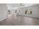 Open-concept living area with sleek floors, bright windows, and a neutral color palette at 246 Castlekeeper Pl, Valrico, FL 33594
