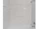 Bathroom shower featuring white tile and fixtures at 246 Castlekeeper Pl, Valrico, FL 33594