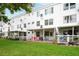 Back exterior view of the building with patios and well-maintained lawn at 2469 Franciscan Dr # 19, Clearwater, FL 33763