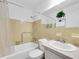 Bathroom featuring a shower and tub combination with tile backsplash and a single sink vanity at 2469 Franciscan Dr # 19, Clearwater, FL 33763