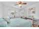 Bright bedroom with a ceiling fan, window and nice furniture at 2469 Franciscan Dr # 19, Clearwater, FL 33763