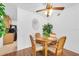 Cozy dining area features a round wooden table with four chairs and decorative accents at 2469 Franciscan Dr # 19, Clearwater, FL 33763