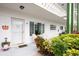 Charming condo entrance with a cozy patio area and view of the well-maintained exterior at 2469 Franciscan Dr # 19, Clearwater, FL 33763