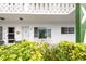 Charming condo exterior with seating, landscaping and a welcoming entrance at 2469 Franciscan Dr # 19, Clearwater, FL 33763