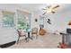 Living space with neutral tile flooring, ceiling fan, and sliding door access at 2469 Franciscan Dr # 19, Clearwater, FL 33763