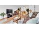 Bright living room showcasing the room's layout, comfortable seating, and modern entertainment setup at 2469 Franciscan Dr # 19, Clearwater, FL 33763