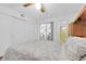 Spacious bedroom with hardwood floors, access to the outside and an en-suite bathroom at 2469 Franciscan Dr # 19, Clearwater, FL 33763