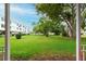 Lush community green space surrounded by mature trees and landscaping at 2469 Franciscan Dr # 19, Clearwater, FL 33763