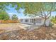 Charming backyard featuring a fire pit and covered patio, perfect for entertaining at 2616 Ohio Pl, Holiday, FL 34691