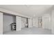 Spacious basement features a laundry area with utility sink, storage, and drop ceiling at 2616 Ohio Pl, Holiday, FL 34691