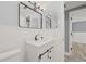 Bathroom featuring modern vanity, decorative mirrors and modern fixtures at 2616 Ohio Pl, Holiday, FL 34691