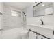Bathroom featuring modern finishes, tub, shower and a sliding door vanity at 2616 Ohio Pl, Holiday, FL 34691