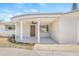 Covered porch of house featuring fluted columns and concrete floor at 2616 Ohio Pl, Holiday, FL 34691