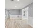 Open-concept layout featuring updated flooring, fresh paint, and easy access to additional rooms at 2616 Ohio Pl, Holiday, FL 34691