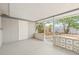 Covered patio with decorative concrete block, leading to a private fenced backyard at 2616 Ohio Pl, Holiday, FL 34691