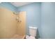 Bathroom features a shower and toilet at 3422 Trask Dr, Holiday, FL 34691