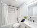 This bathroom offers shower-tub, vanity, and ceramic tile backsplash at 3422 Trask Dr, Holiday, FL 34691